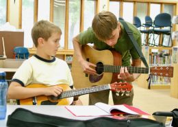Guitar teacher and student